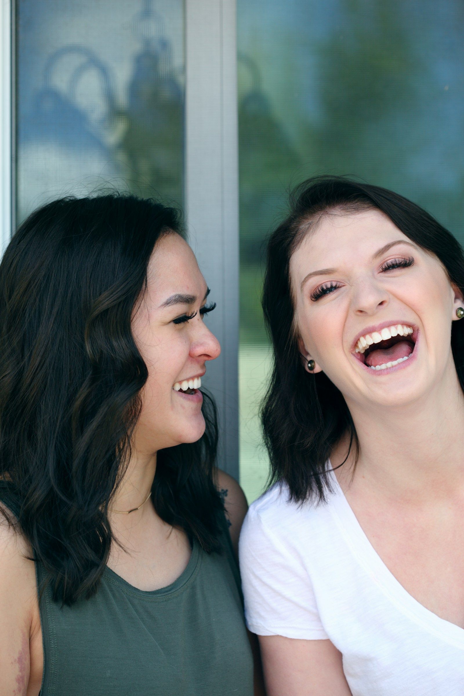 Two women laughing together